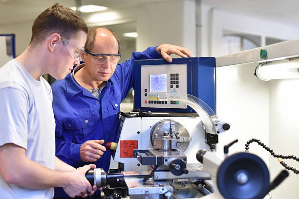 Workshop interior with machinery and workers